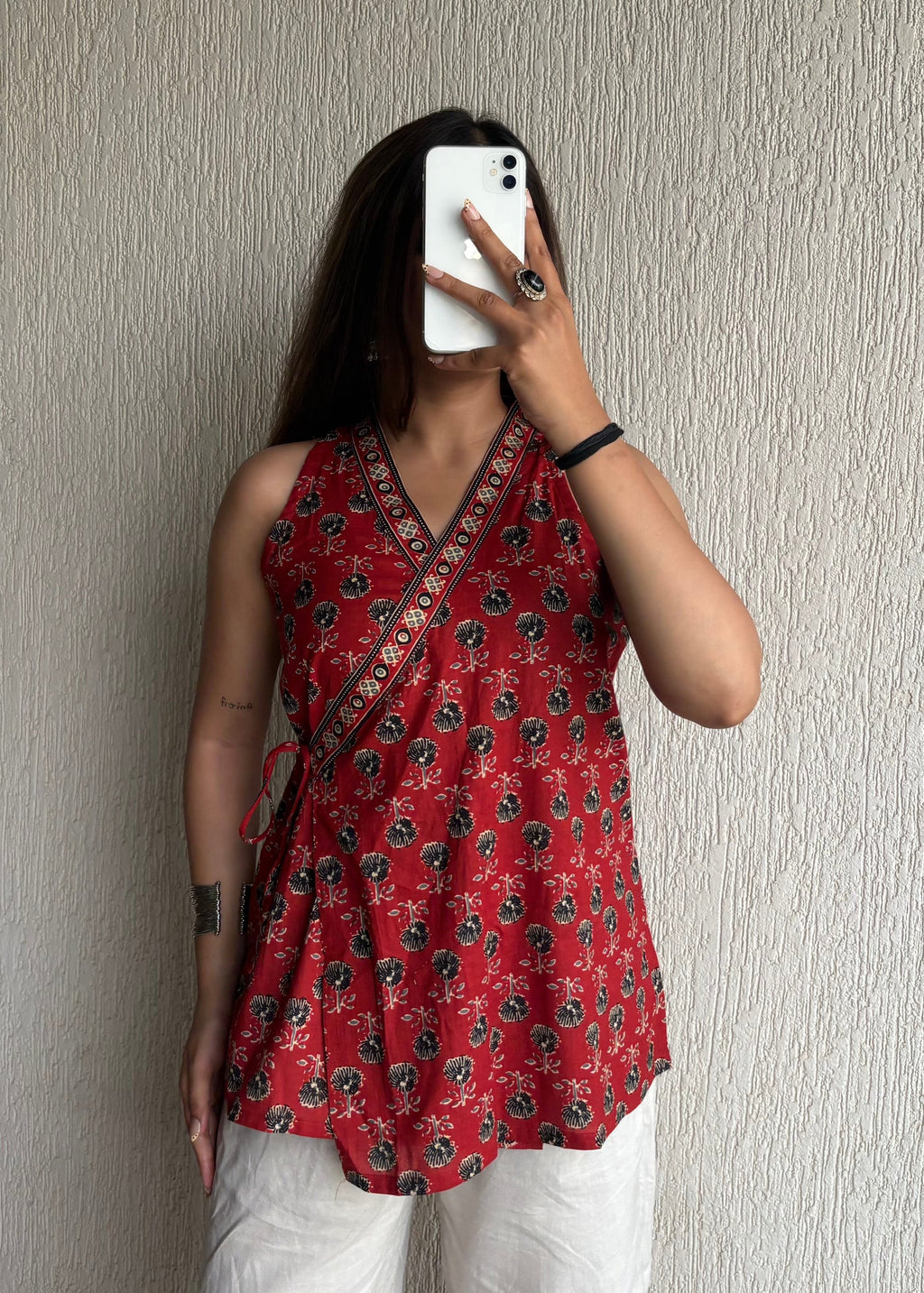 Red sleeveless wrap-tie short kurti