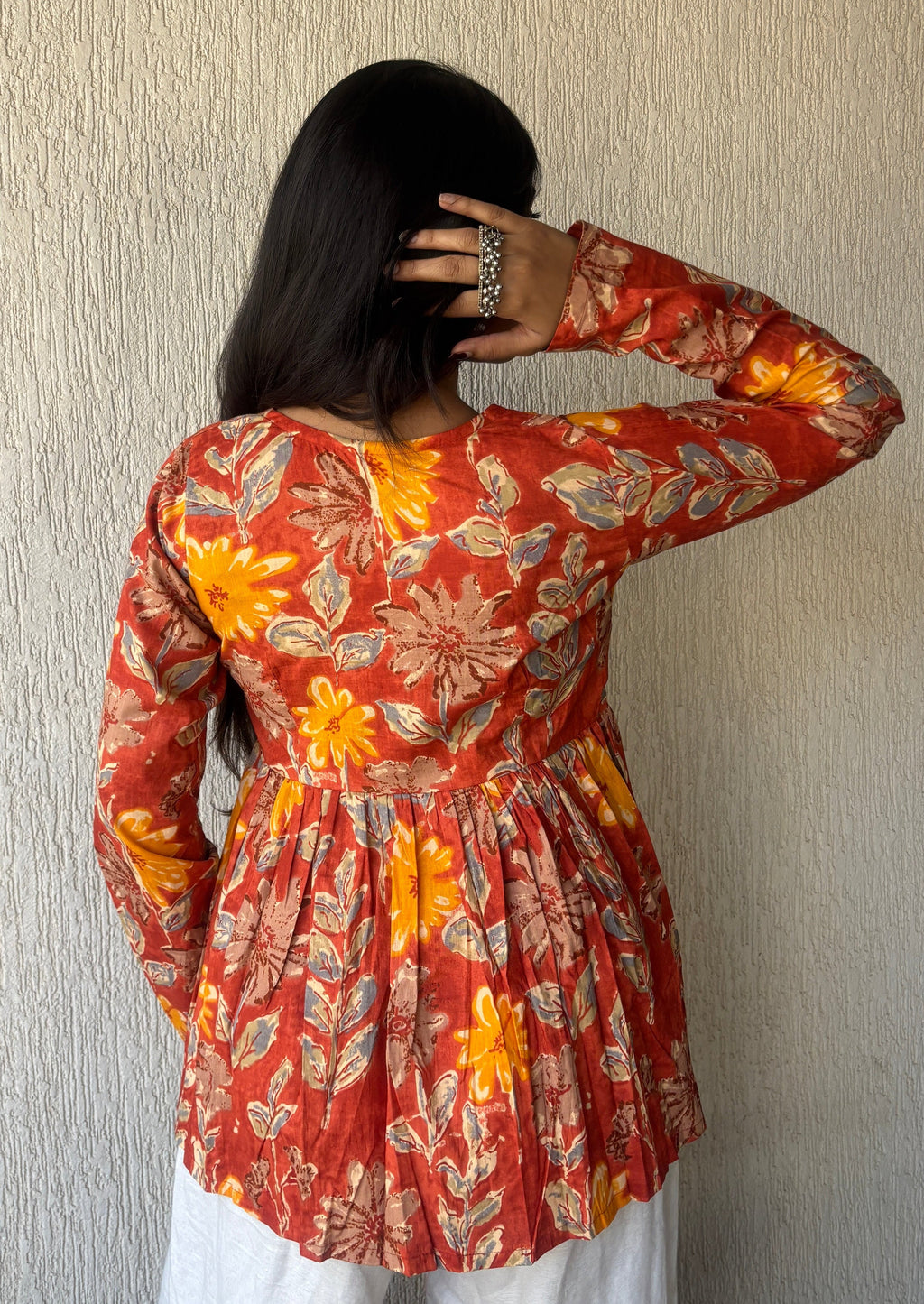 Orange peplum style short kurti