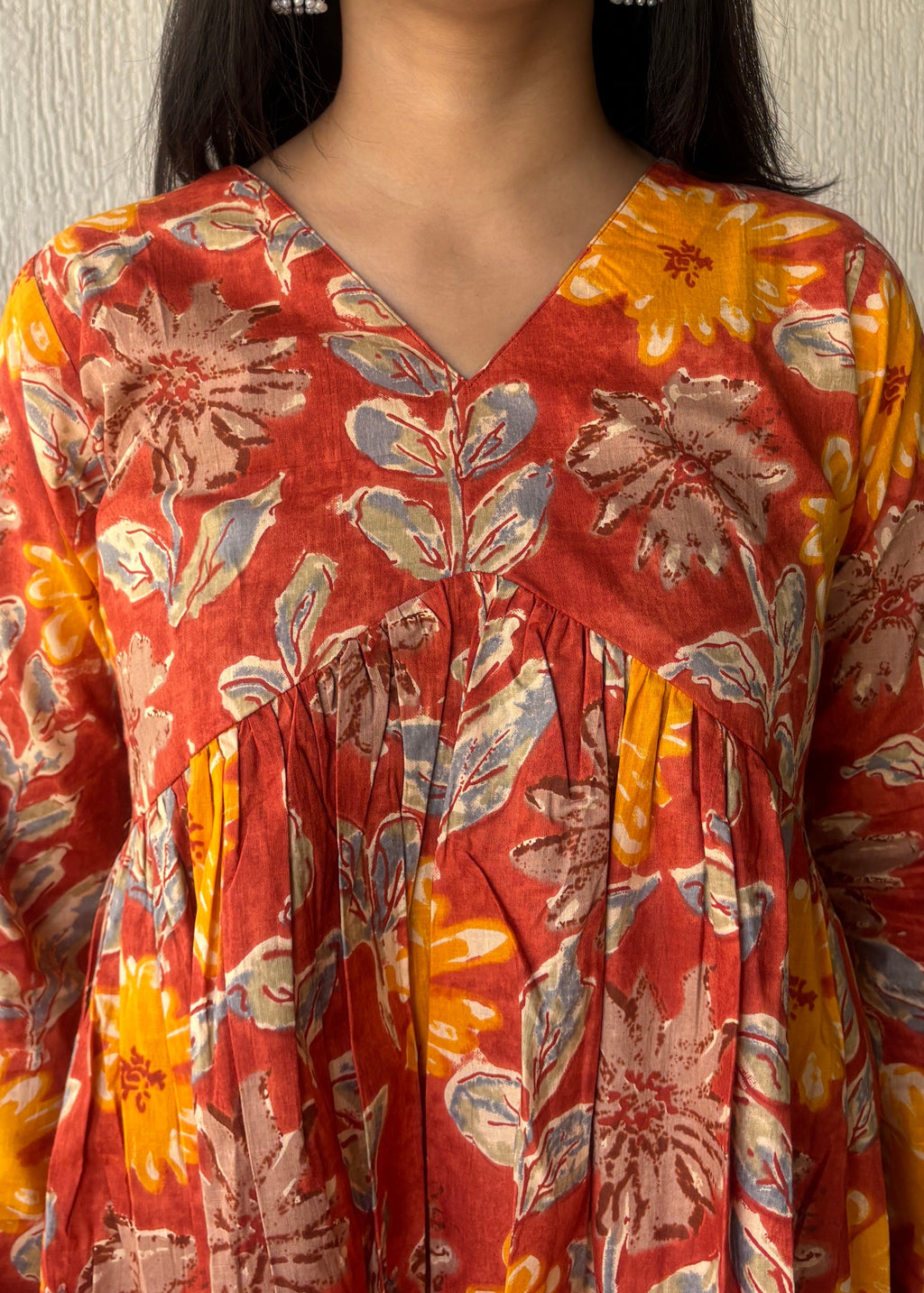 Orange peplum style short kurti